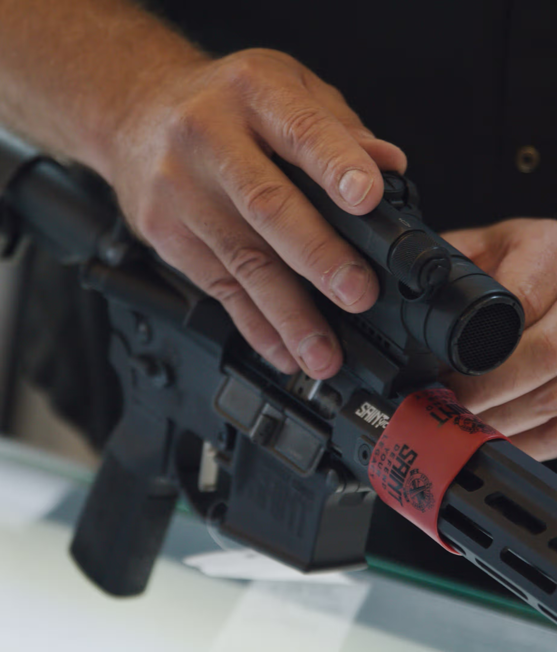 A gunsmith at Magnum working on the sight of a Saint Defence AR-platform rifle.